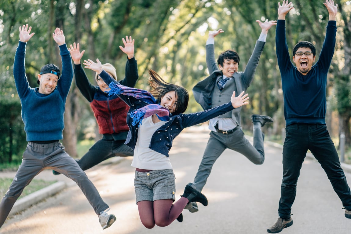 Japanese friends jumping together